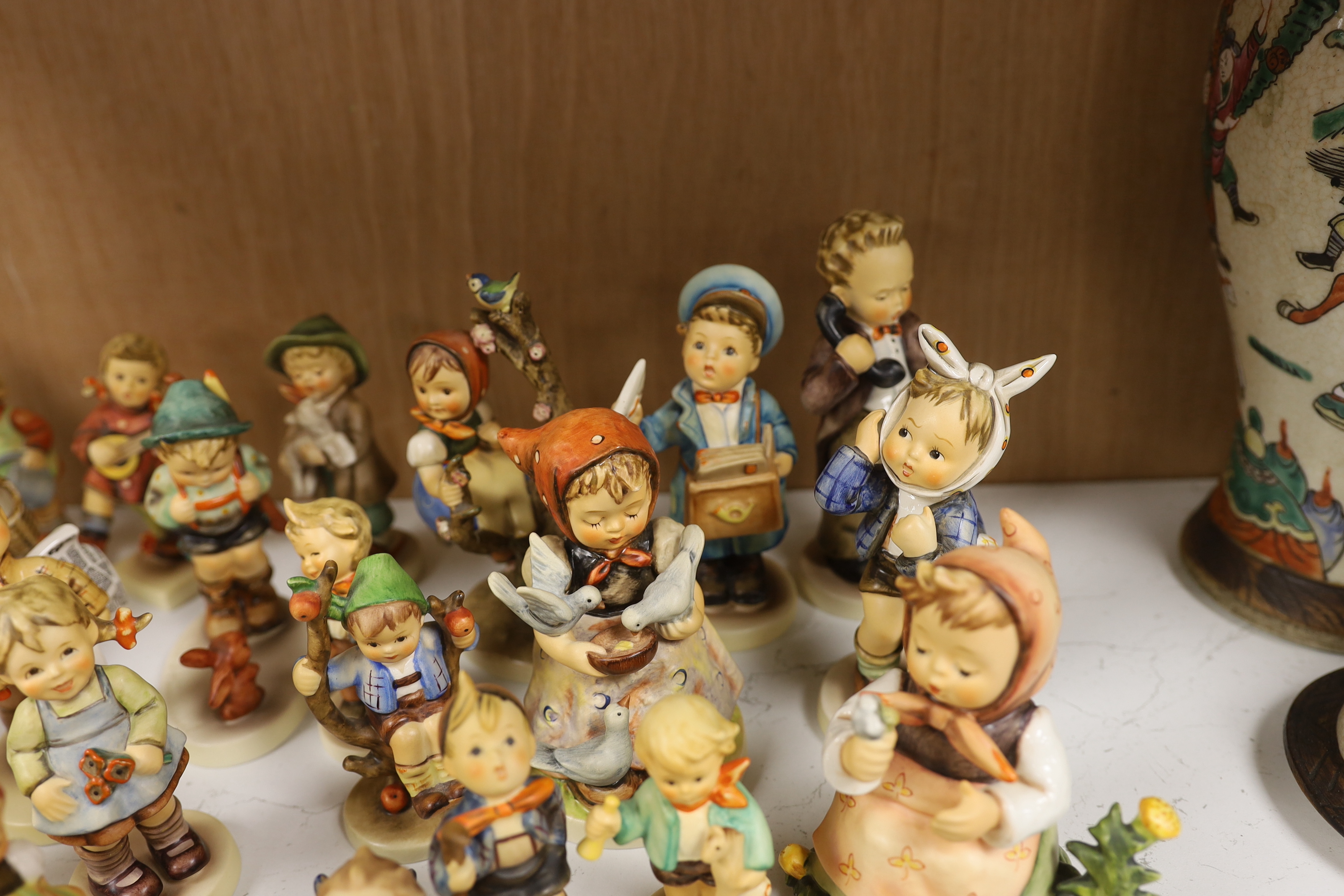 Twenty eight Goebel Hummel figures, largest 15cm high